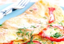 Kefir omelet in a pan with bell pepper and herbs